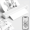 White Phomemo M08F tattoo stencil printer printing black line art design, with mobile app preview displayed