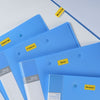 Blue office folders with yellow Phomemo labels for file organization
